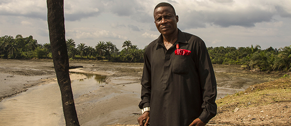 Nigerian farmer Eric Dooh overlooks oil spills in Niger Delta