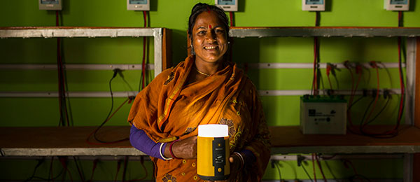 Woman with solar energy lamp in Bangladesh