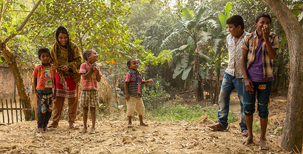 Four children playing in village in Bangladesh